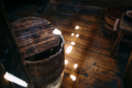 Wooden winch of a sailing ship and ropes on the deck of medieval pirate warship photo