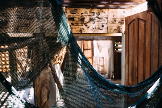 Wooden winch of a sailing ship and ropes on the deck of medieval pirate warship photo