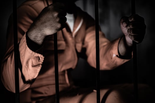 Asian man desperate at the iron prison,prisoner concept,thailand people,Hope to be free,Serious prisoners imprisoned in the prison photo