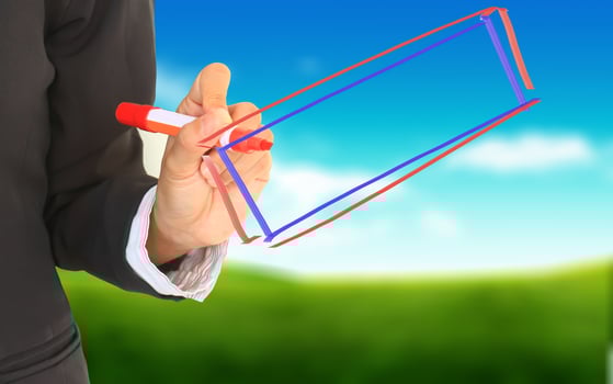 Businesswoman drawing diagram on a natural background. photo