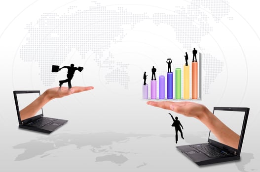 Hand  out of an Laptop with silhouette people and graph photo