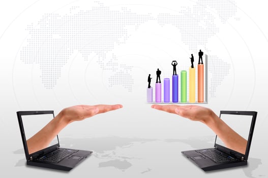 Hand  out of an Laptop with silhouette people and graph photo