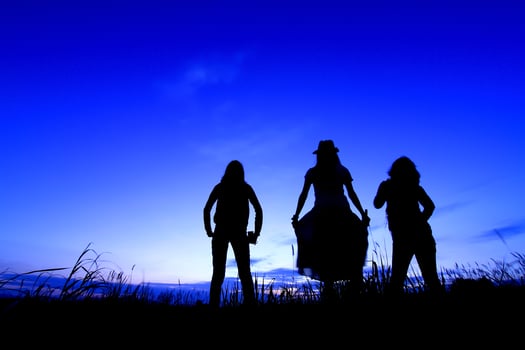 Happy woman   and sunset silhouette photo