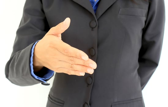 Businessman stretching out hand.Isolated on white photo
