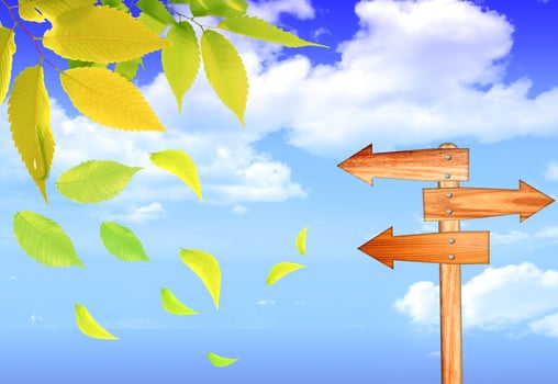arrow sign on blue sky with clouds photo