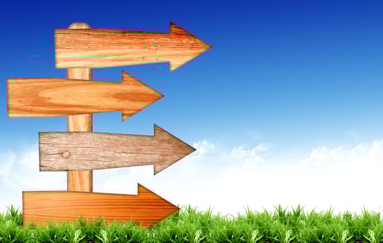 arrow sign on blue sky with clouds photo