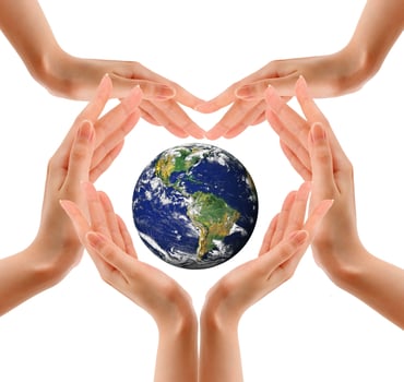 earth in hands isolated on white photo