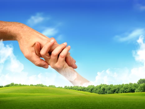 Hand touches hand photo