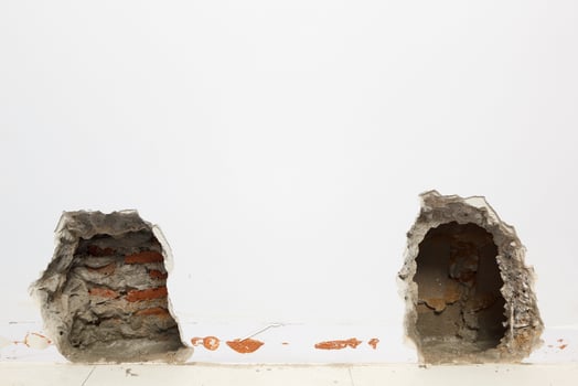 Concrete walls in the shade that have been smashed or destroyed to find holes for water leaks. Home repair concept. photo