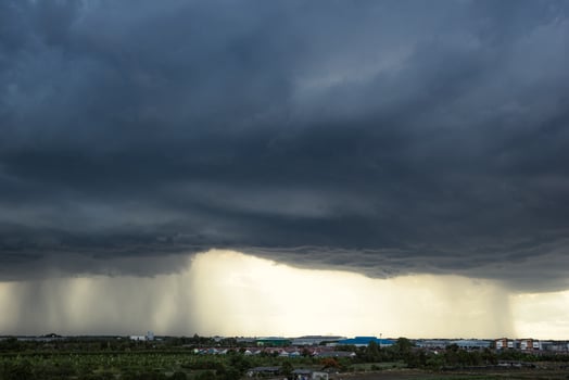 The dark sky with heavy clouds converging and a violent storm before the rain. photo