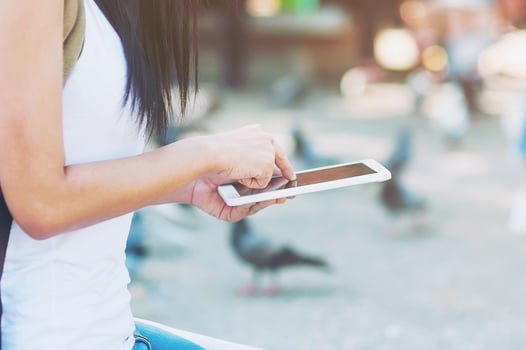 Young woman back pack traveler using tablet in the city - outdoor asian traveler activity concept photo