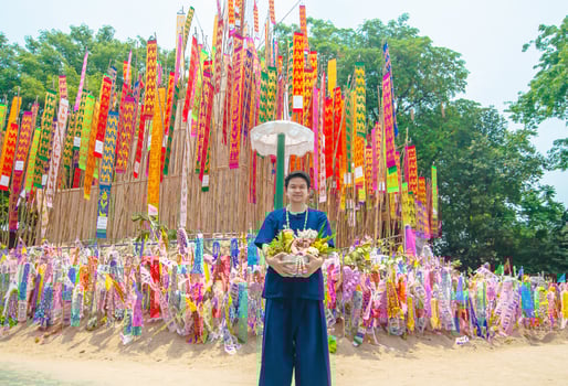 Thai Northern lady participate old traditional activity in a temple during Songkran festival in Chiang Mai Northern Thailand very famous event of Thailand photo