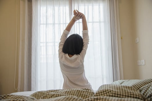 Lady wake up stretch oneself lazily for fresh morning - health care concept photo
