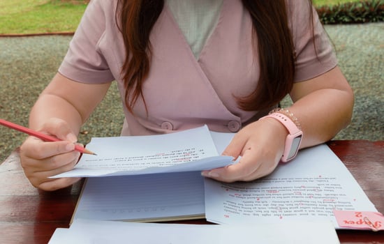 woman working on paperwork on table photo