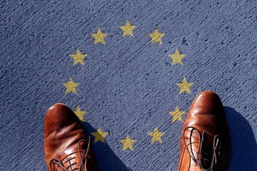 Man looking down on the European Union flag photo
