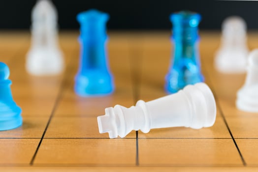 Chess glass on a wood chessboard photo
