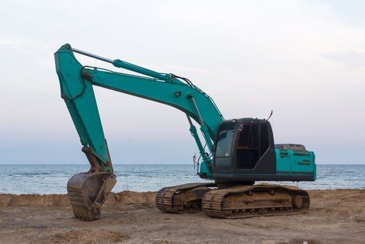 Excavator on sand photo
