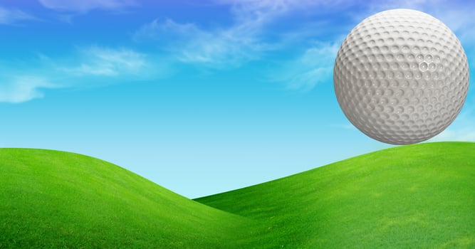 Golf Ball on the Green Grass photo