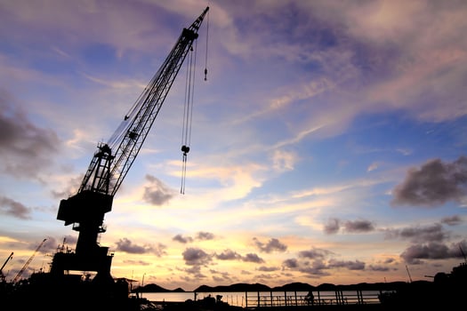Cranes in dockside at sunset photo