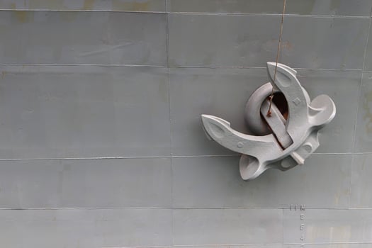 Old anchor on gray background photo
