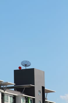 Satellite dish on the commercail building photo