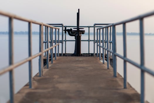 The walkway opens and closes the dam's water gate. photo