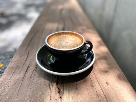 Hot coffee cup on table photo