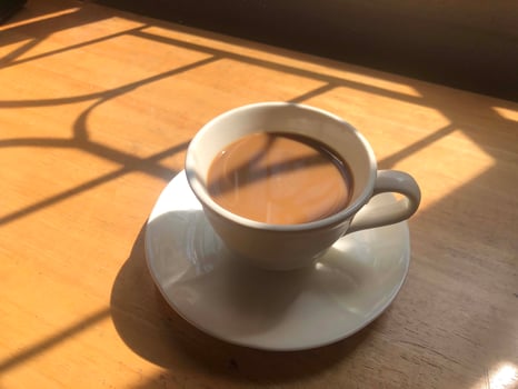 Hot coffee cup on table photo