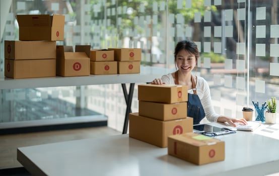 Starting Small business entrepreneur freelance, Portrait young woman working at home office, BOX, smartphone, laptop, online, marketing, packaging, delivery, b2b, SME, e-commerce concept photo