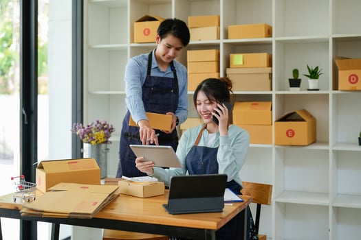 Asian couples doing SMEs deliver their products online to customers who order products via the Internet, helping to sell happily  Work From Home online photo
