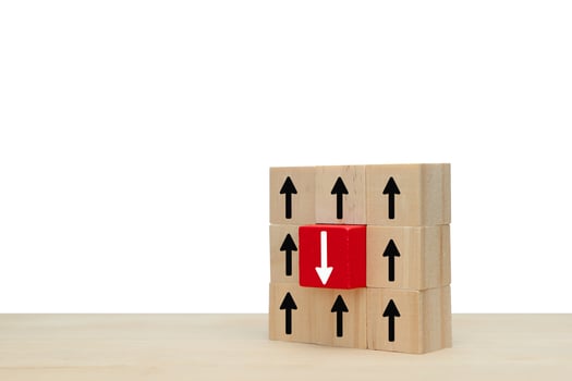 Business icon up and down symbol up and down investment or growth on wooden cube photo