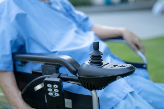 Asian senior or elderly old lady woman patient on electric wheelchair with remote control at nursing hospital ward, healthy strong medical concept photo