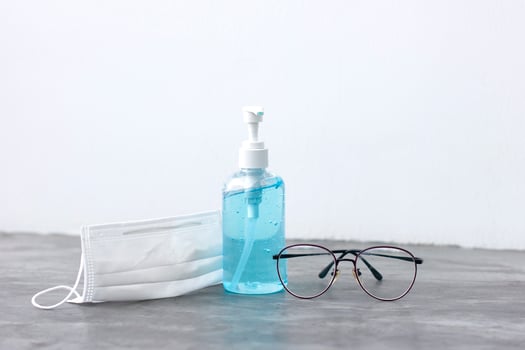 Surgical masks and hand sanitizer gel for hand hygiene virus protection. photo