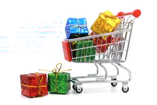 Shopping cart isolated with gift on white background. photo