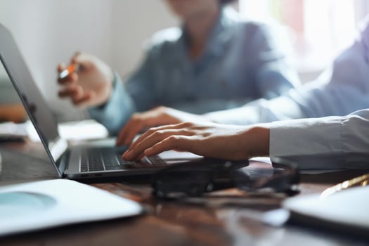 business woman using laptop hand typing on keyboard for meeting team in office. finance and accounting concept photo