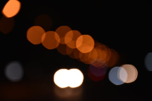 Bokeh street light at night time in urban city of thailand. photo