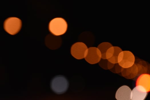 Bokeh street light at night time in urban city of thailand. photo