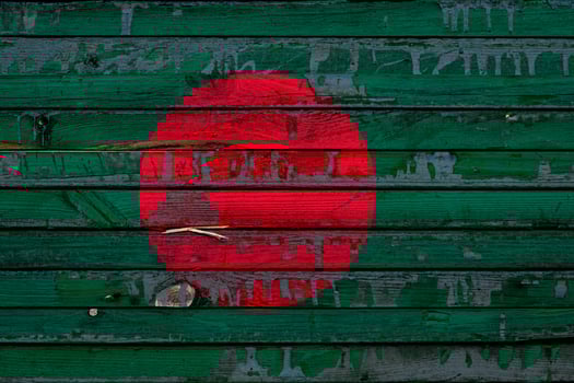 The national flag of Bangladesh  is painted on uneven boards. Country symbol. photo