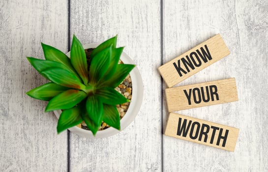 Know your worth symbol. Concept words Know your worth on wooden blocks. photo