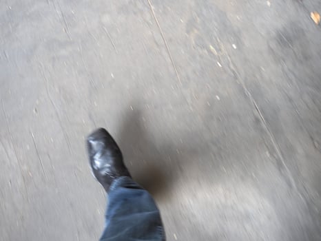 personal pov of man walking with motion blur photo