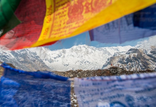 The prayer flag and mount Annapurna I the 10th highest peak of the world in Annapurna conservation area of Nepal. photo