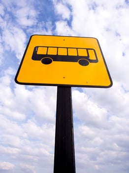 Bus stop sign in rural road photo