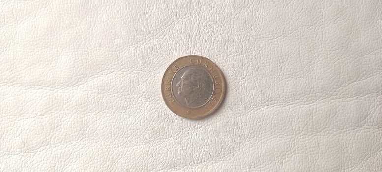 1 Turkish lira on white background photo