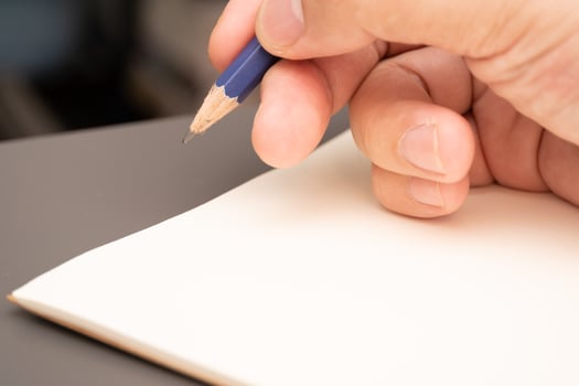hand writing on the paper on desk office. photo