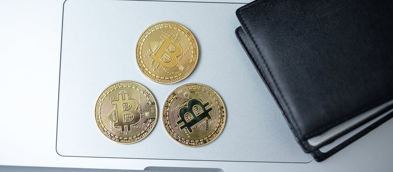 golden Cryptocurrency and wallet on keyboard laptop, Bitcoin coin. Crypto is Digital Money within the blockchain network photo