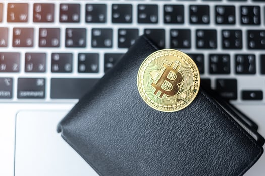 golden Cryptocurrency and wallet on keyboard laptop, Bitcoin coin. Crypto is Digital Money within the blockchain network photo