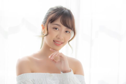 Beautiful portrait young asian woman makeup of cosmetic, asia girl smile and happy attractive, face beauty perfect with wellness skin care and healthcare, lifestyle wellbeing concept. photo