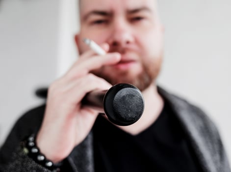 stylish bearded man smoking photo