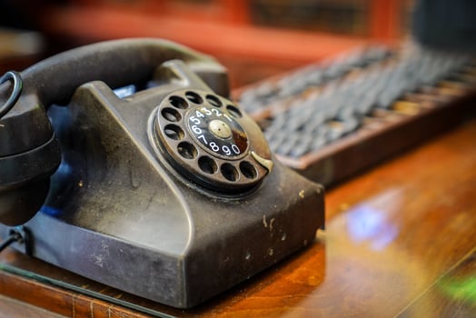 Vintage steel telephone on the wood tabel. photo