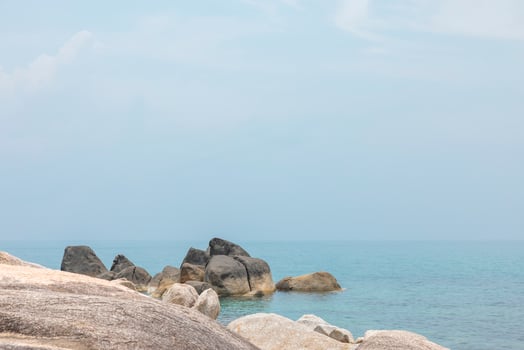 Sea landscape with rocks in the foreground and sky in the background. Therapeutic natural scenery gives a feeling of relaxation. At Koh Samui, Surat Thani Province, Thailand photo